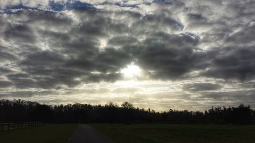 Scenic view of landscape against cloudy sky