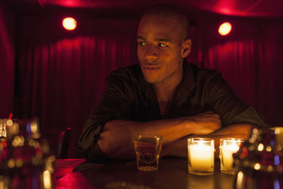 Young man enjoying a drink at a bar