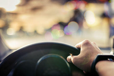 Close-up of hand on road