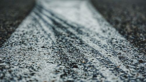 Full frame shot of tire marks on road