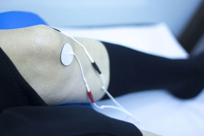 Close-up of man lying down on bed