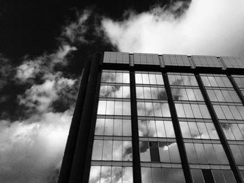 Low angle view of building against cloudy sky