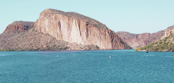 Scenic view of sea against clear blue sky