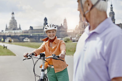 People riding bicycle on city