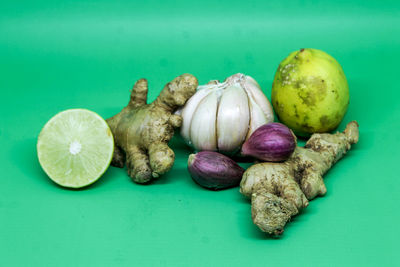 High angle view of fruits on blue background