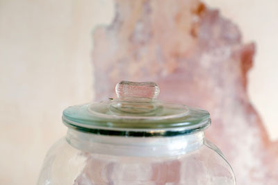 Close-up of glass bottle on table