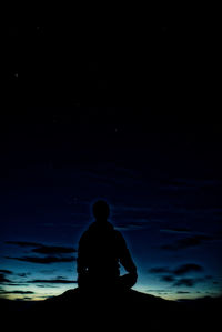 Silhouette of man standing on beach