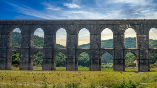 Arch bridge against cloudy sky, mimar sinan aqueduct maglova kemari