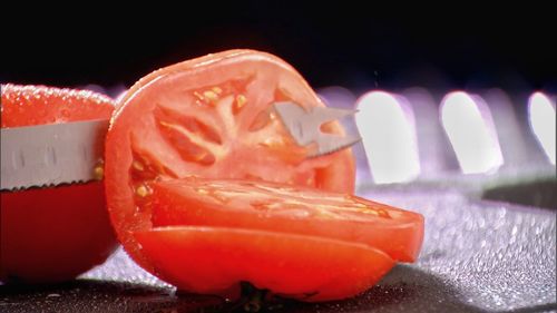 Close-up of ice cream cone against black background