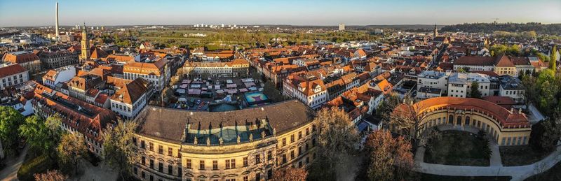 High angle view of city buildings against sky