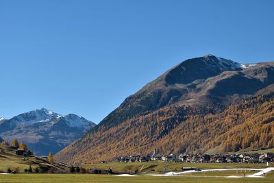 Scenic view of mountains against clear blue sky