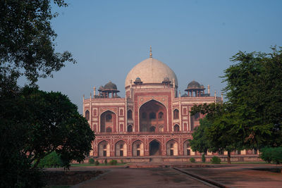 Facade of historic building against clear sky