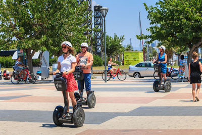 People riding bicycle on road