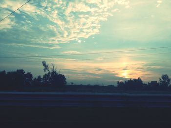 Scenic view of silhouette landscape against sky at sunset