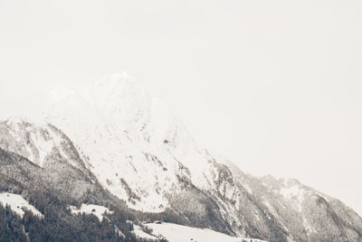 Scenic view of snowcapped mountains against clear sky