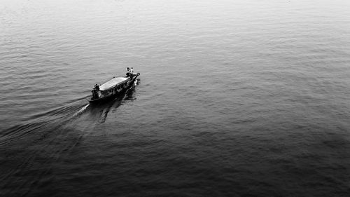 High angle view of people sailing on sea