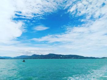 Scenic view of sea against cloudy sky