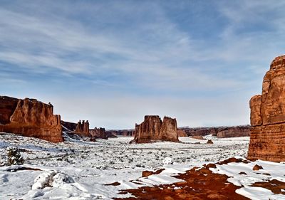 Scenic view of landscape against sky during winter