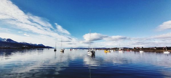 Panoramic view of sea against blue sky