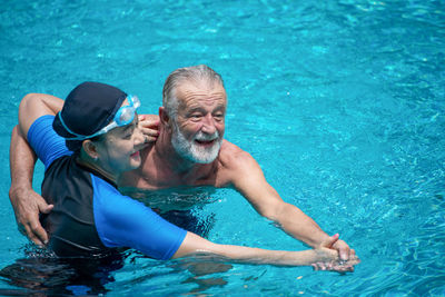 Man swimming in pool