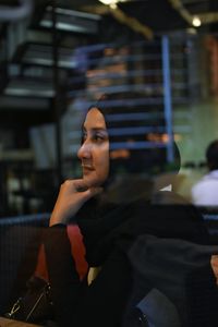 Young woman sitting outdoors