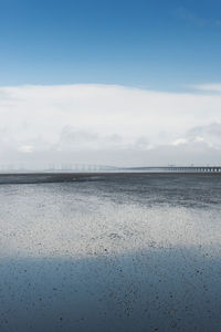 Scenic view of sea against cloudy sky