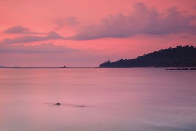 Scenic view of sea against sky at sunset