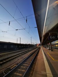 Train at railroad station against sky