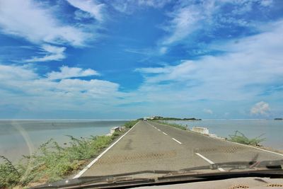 Scenic view of sea against cloudy sky
