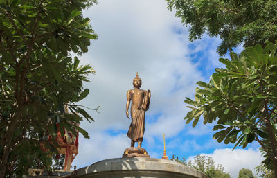 Low angle view of statue against sky