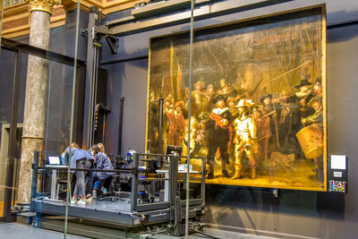 People working in glass window