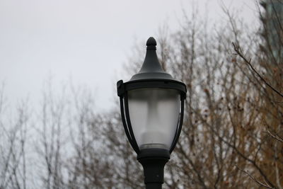 Low angle view of street light against sky