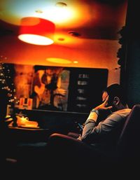 Woman sitting on sofa