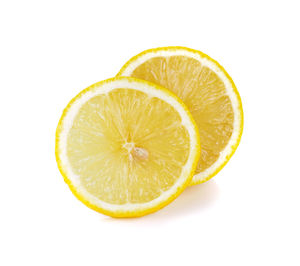 Close-up of lemon slice against white background