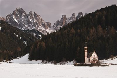 Scenic view of snow covered mountains against sky