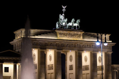 Low angle view of statue at night