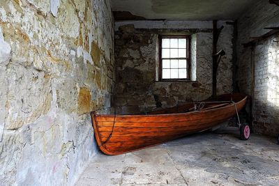 Damaged boat in abandoned building