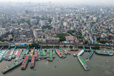 High angle view of crowd by buildings in city