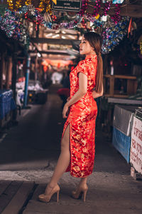 Full length of woman standing on street