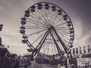 Low angle view of ferris wheel against sky