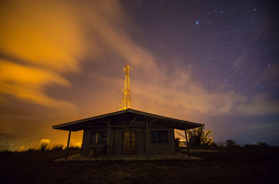 Low angle view of traditional building against sky at night