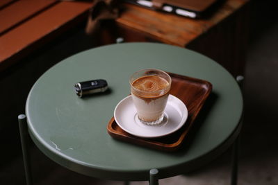 High angle view of coffee served on table