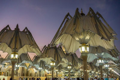 Low angle view of illuminated tent against sky