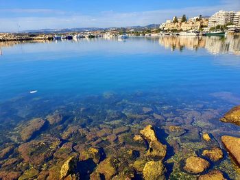 Scenic view of lake against blue sky