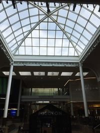 Low angle view of illuminated shopping mall