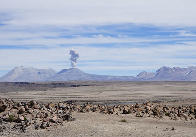 Scenic view of arid landscape against sky