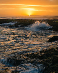 Scenic view of sea against sky during sunset
