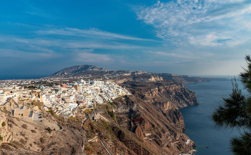 Panoramic view of sea and buildings against sky