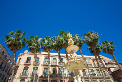 Low angle view of building against blue sky