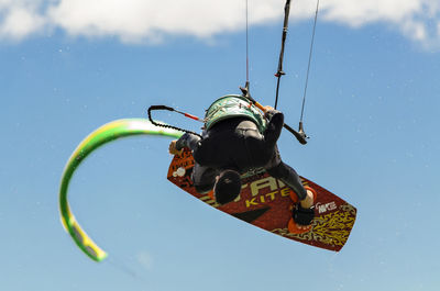 Low angle view of man skateboarding against sky